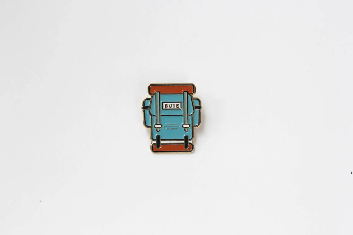 Buie & Co. enamel backpack pin