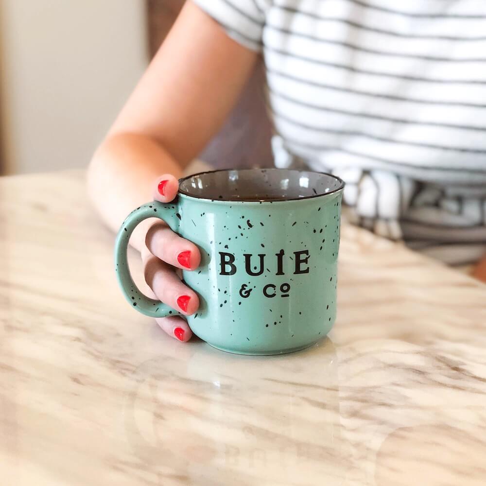 Woman holding Buie mug